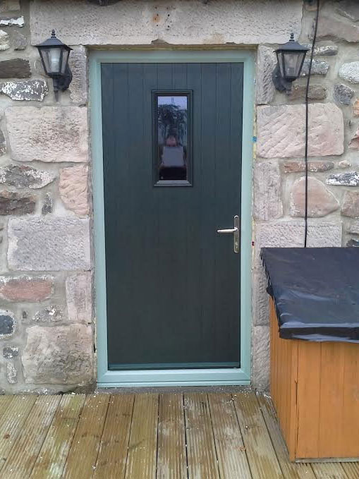 black composite front door with side panels